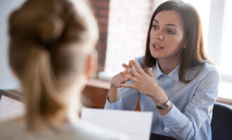 Confident,Focused,Businesswoman,,Teacher,Or,Mentor,Coach,Speaking,To,Business