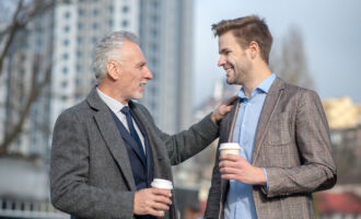 Friends.,Young,Businessman,And,His,Mature,Mentor,Smiling,While,Having