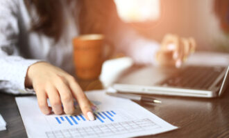 Hands,Of,Financial,Manager,Taking,Notes,When,Working